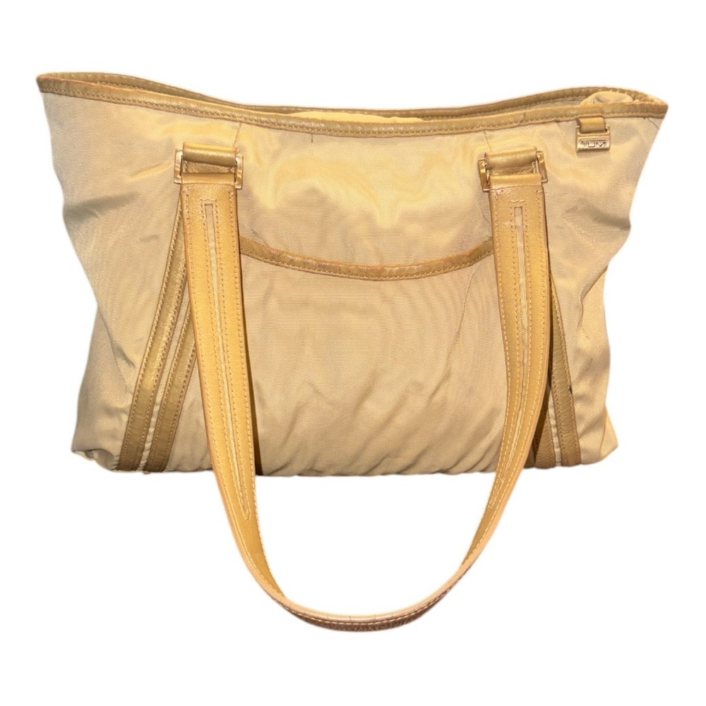 Tumi Canvas w/Shimmery Leather trim travel bag. B 21
